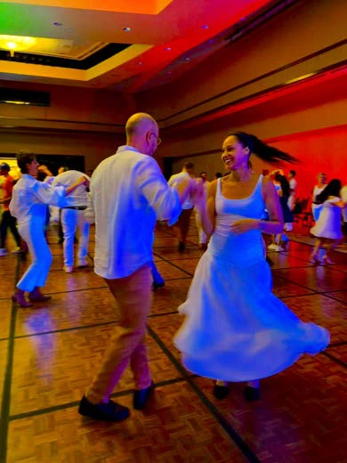 Dancers gathered at a Latin dance social